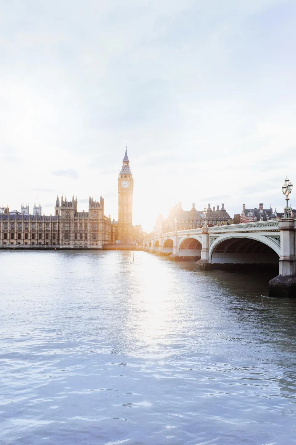 Westminster and the River Thames in London at sunrise (stock photograph)